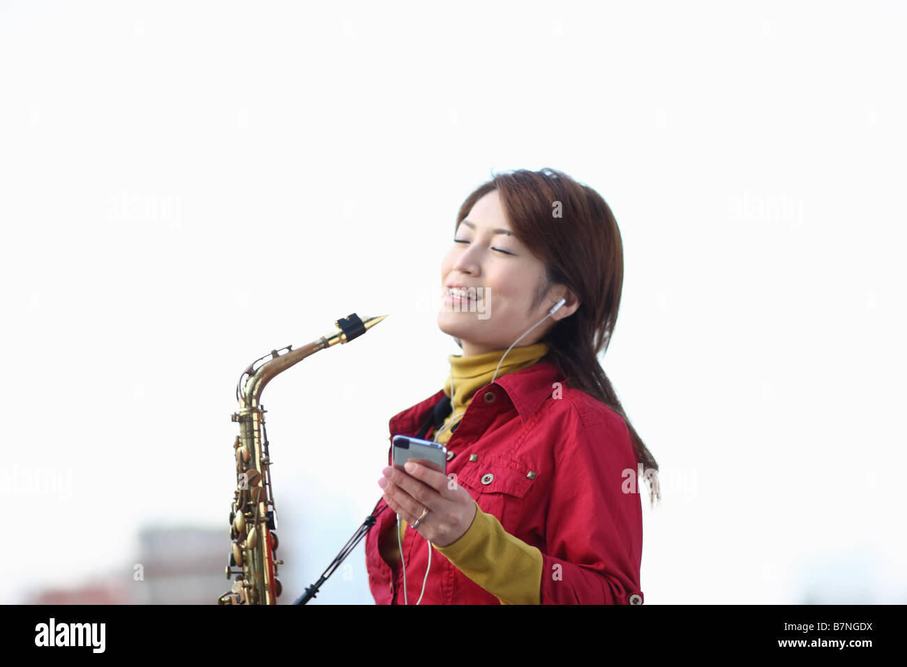 A woman with saxophone Stock Photo