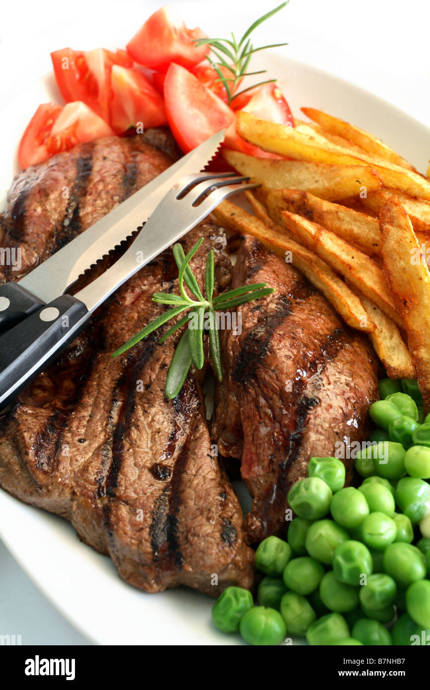 A Traditional Steak Grill With Rump Steak French Fried Potato Chips a-traditional-steak-grill-with-rump-steak-french-fried-potato-chips