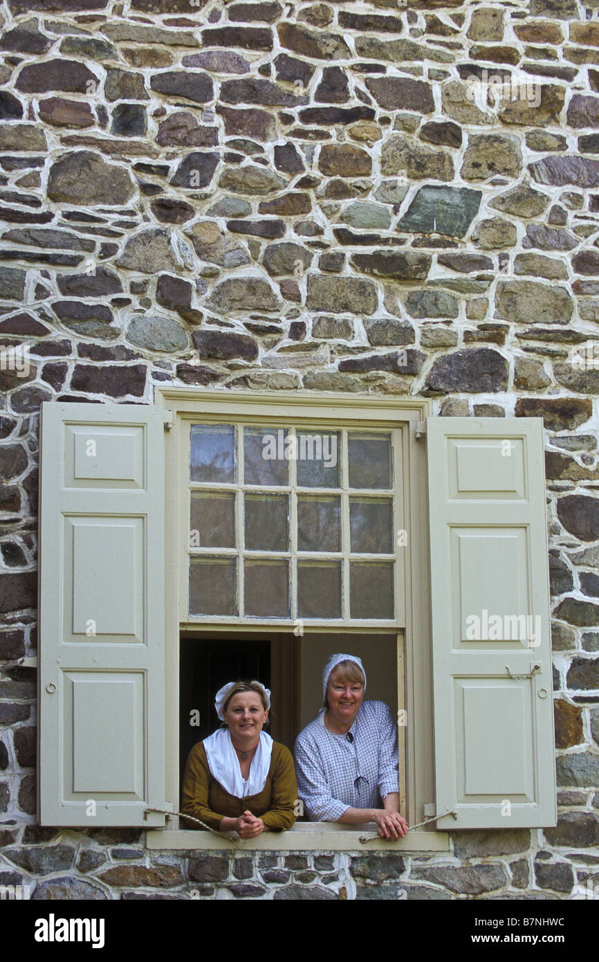 Docents look out the window at Washington's Headquarters, Valley Forge National Historical Park, Pennsylvania. Stock Photo