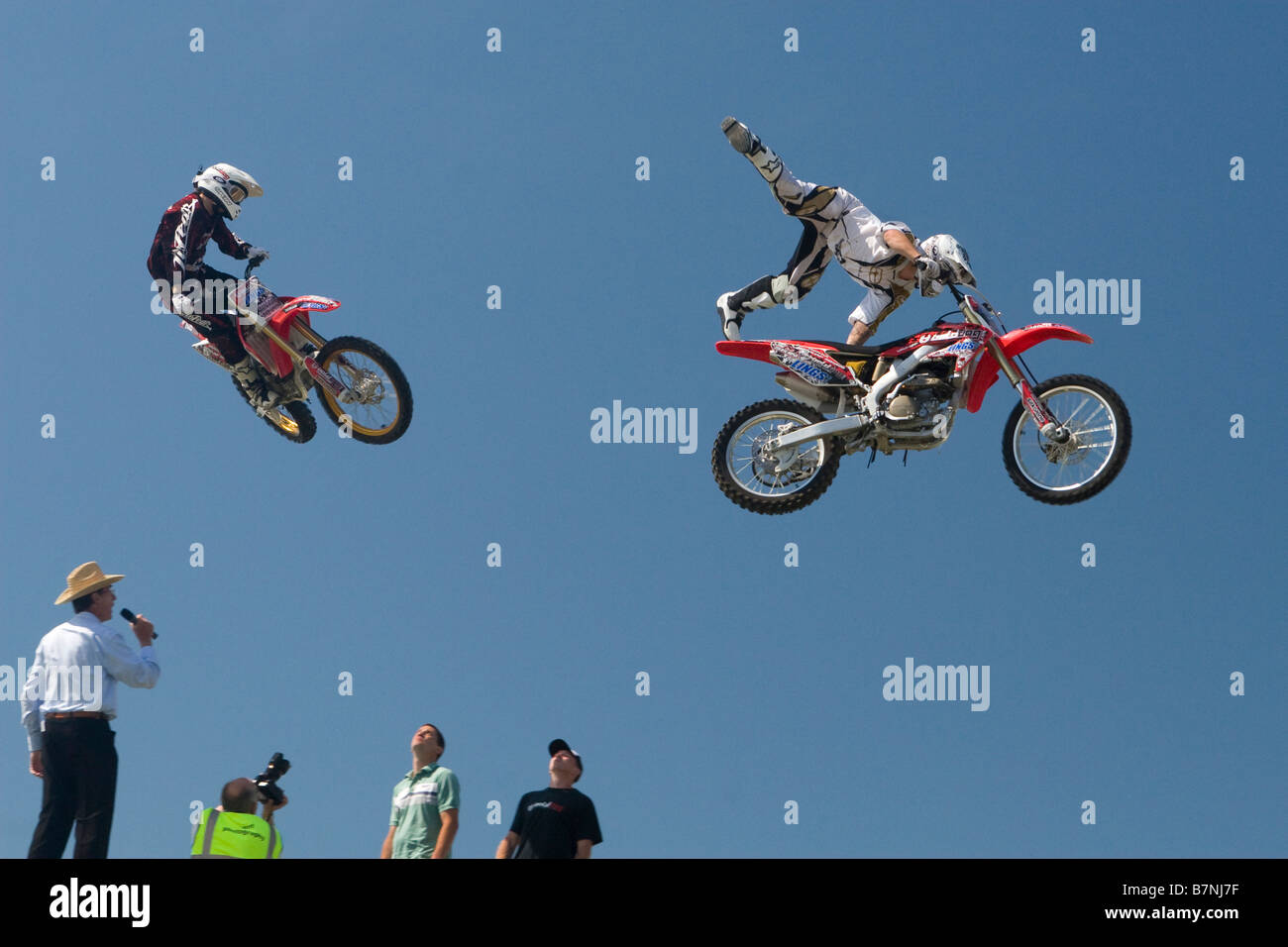 Motorbikes jumping over a ramp sky pictures Stock Photo Alamy