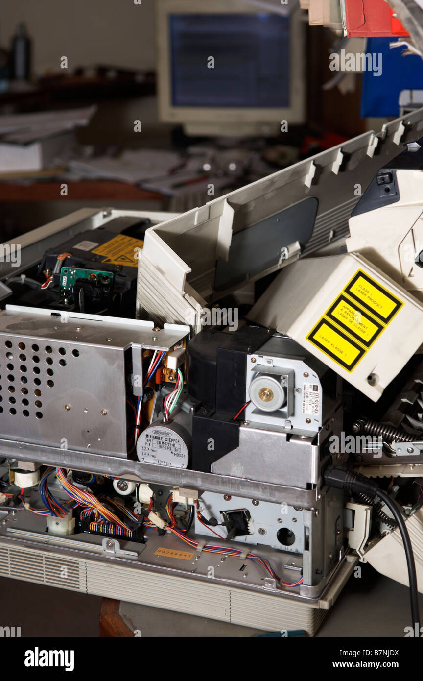 Broken laser printer in office now electrical scrap for recycling Stock Photo
