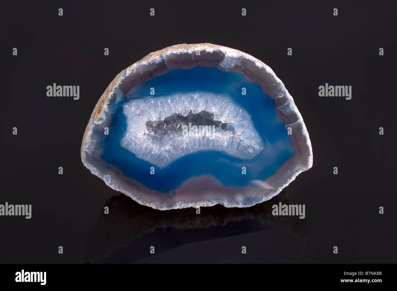 Agate geode, blue, large, on black background Stock Photo