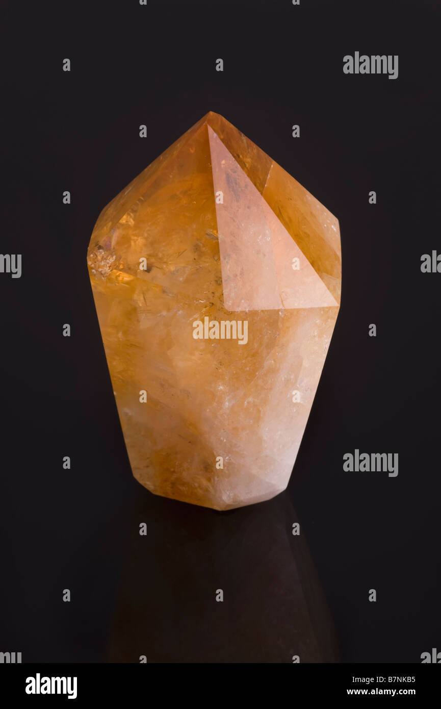 Citrine quartz crystal on black background Stock Photo Alamy