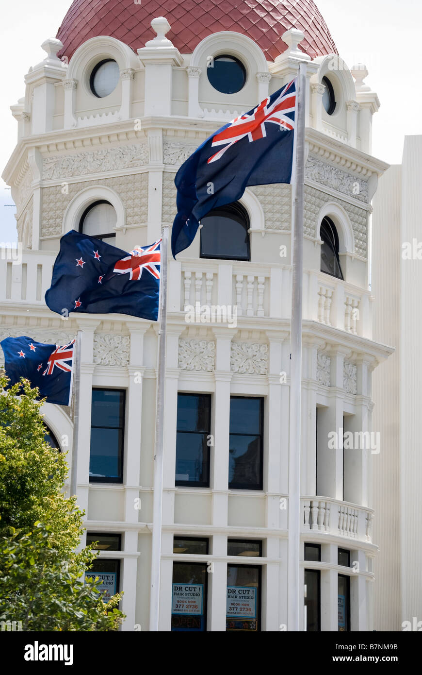 New Zealand flags in front of The Regent Building, Cathedral Square, Christchurch, Canterbury, New Zealand Stock Photo