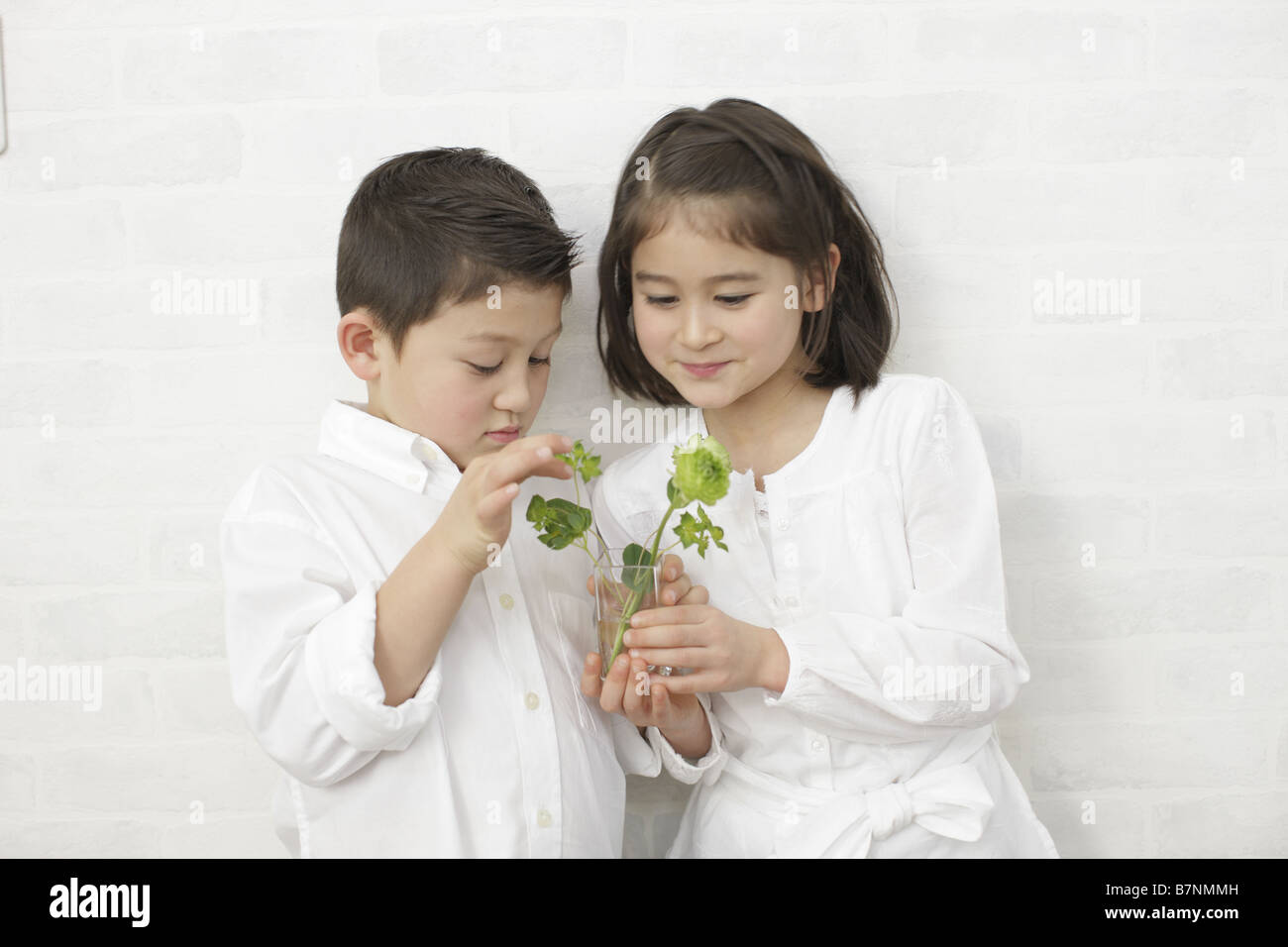 Children holding flowers Stock Photo