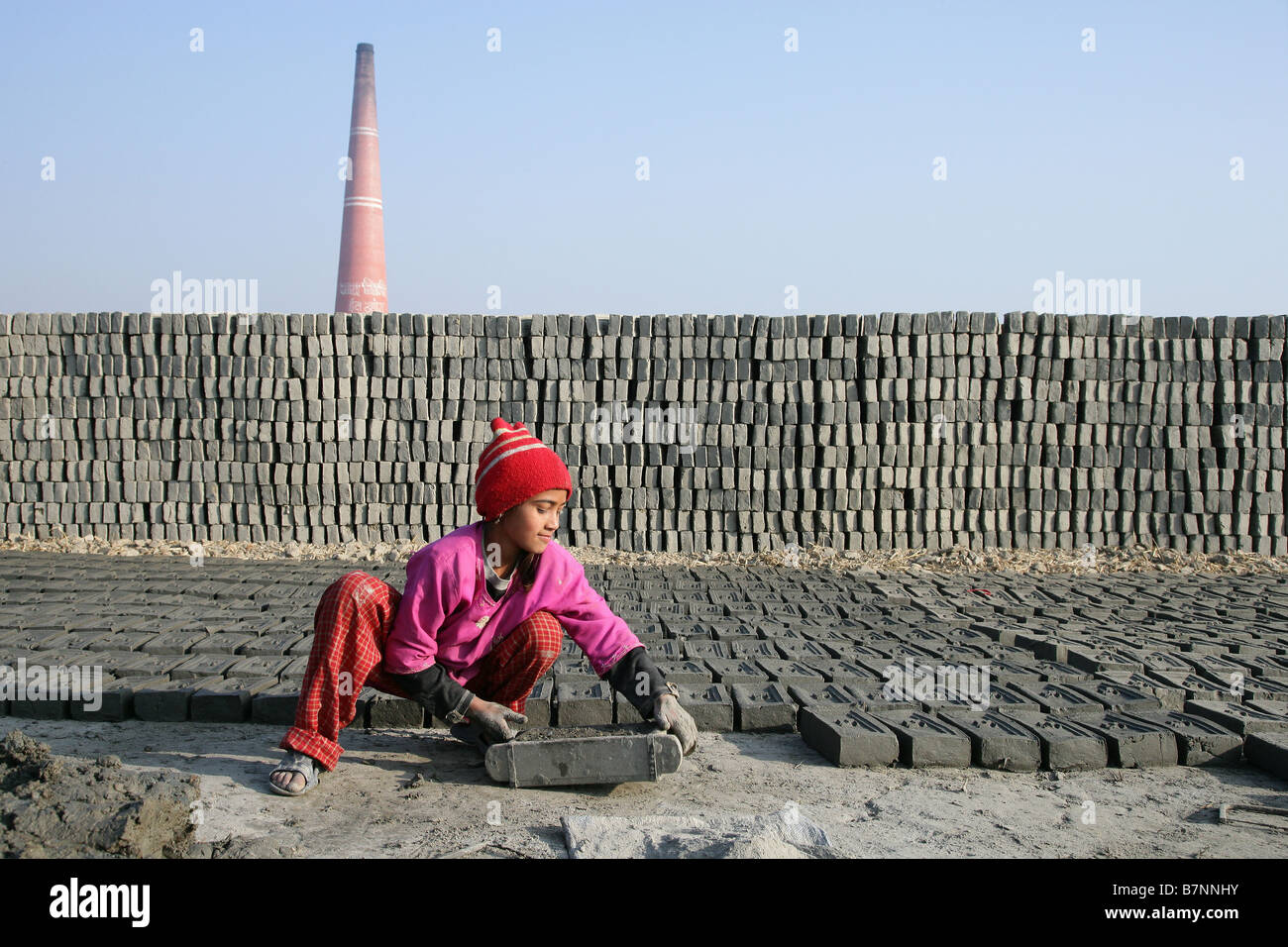 Prava Thapa making bricks Stock Photo