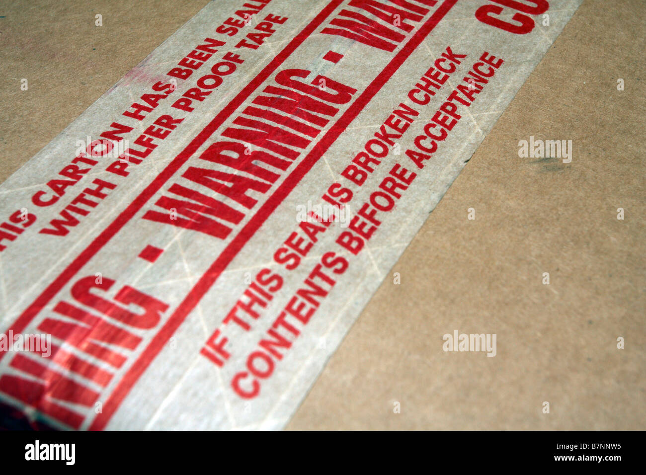 Cardboard box taped seam showing tamperevident tamper evident tape