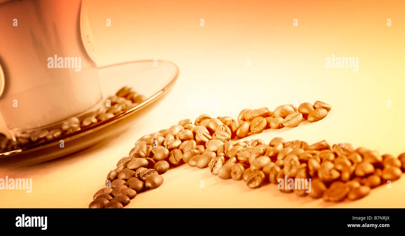 Cup with coffee, costing on coffee grain Stock Photo