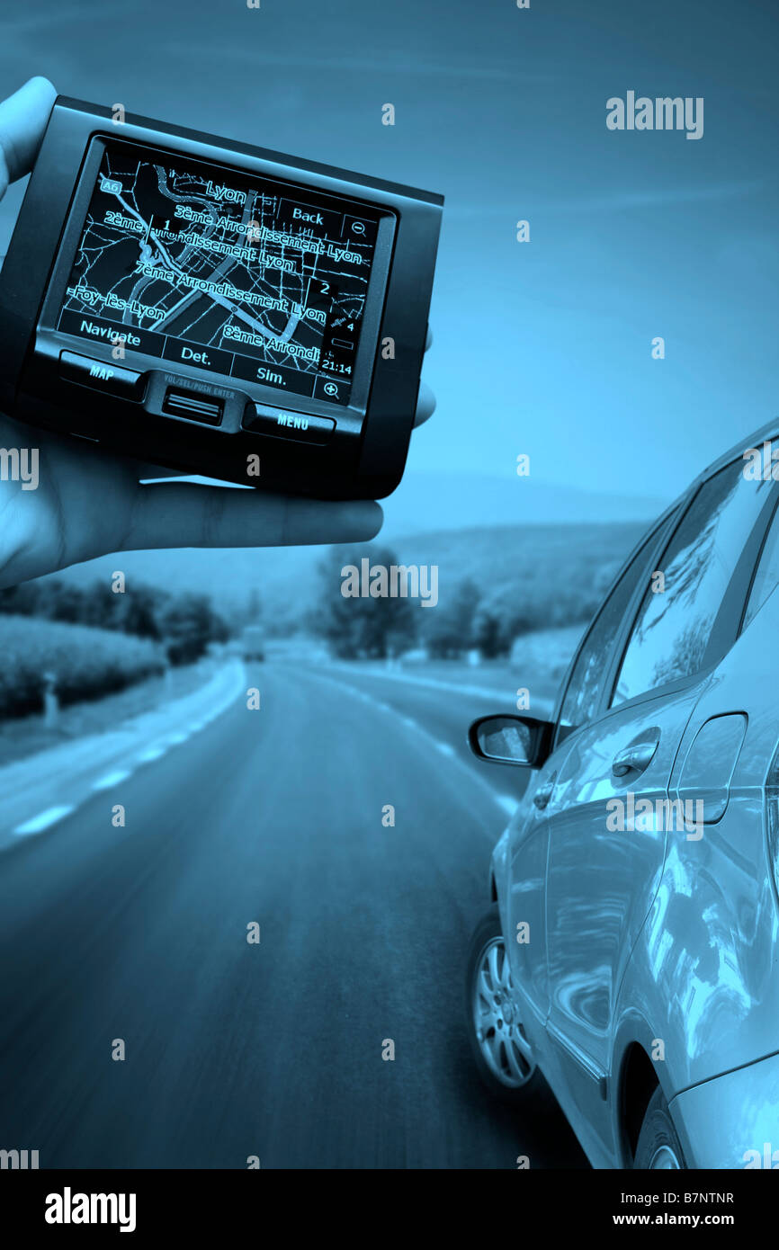 GPS Vehicle navigation system in a man hand Stock Photo Alamy