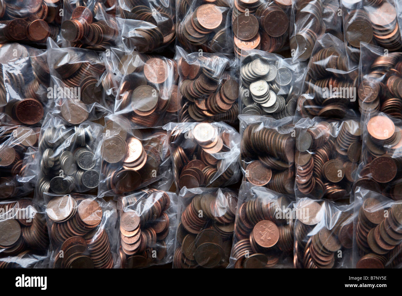 Plastic bags containing British coins Stock Photo Alamy