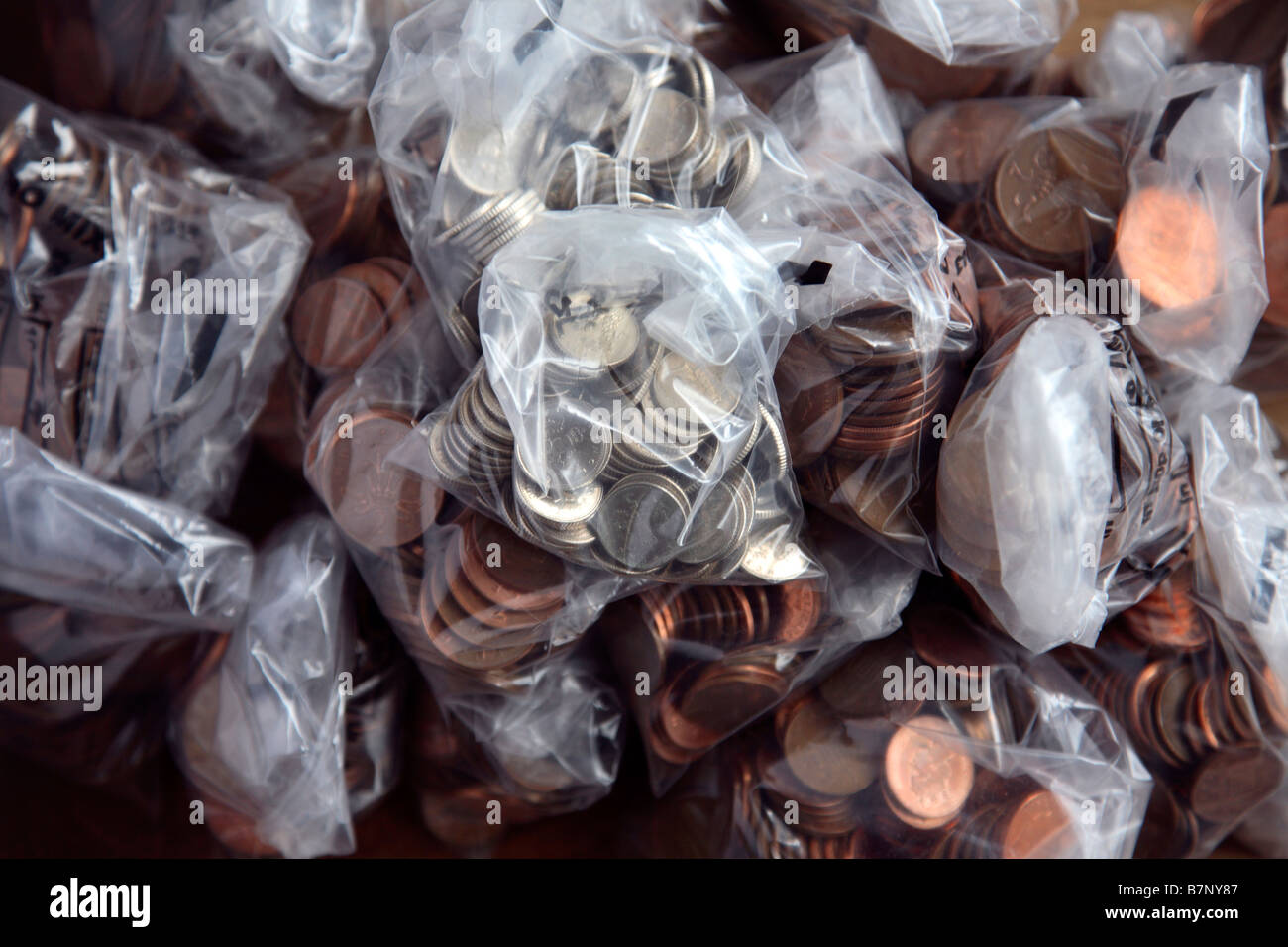 Plastic bags containing British coins Stock Photo Alamy