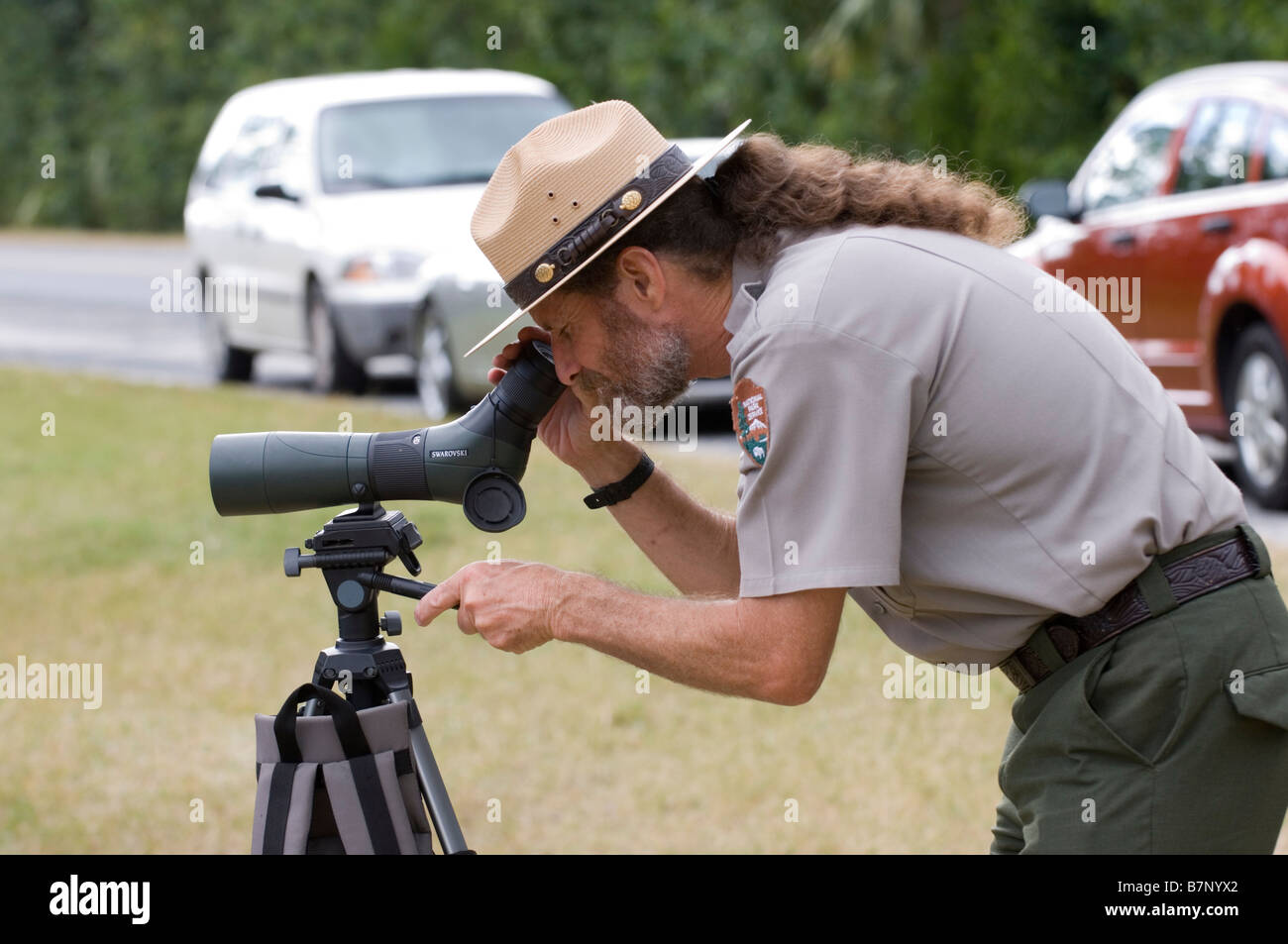 park ranger looking through scope in florida everglades national park Stock Photo