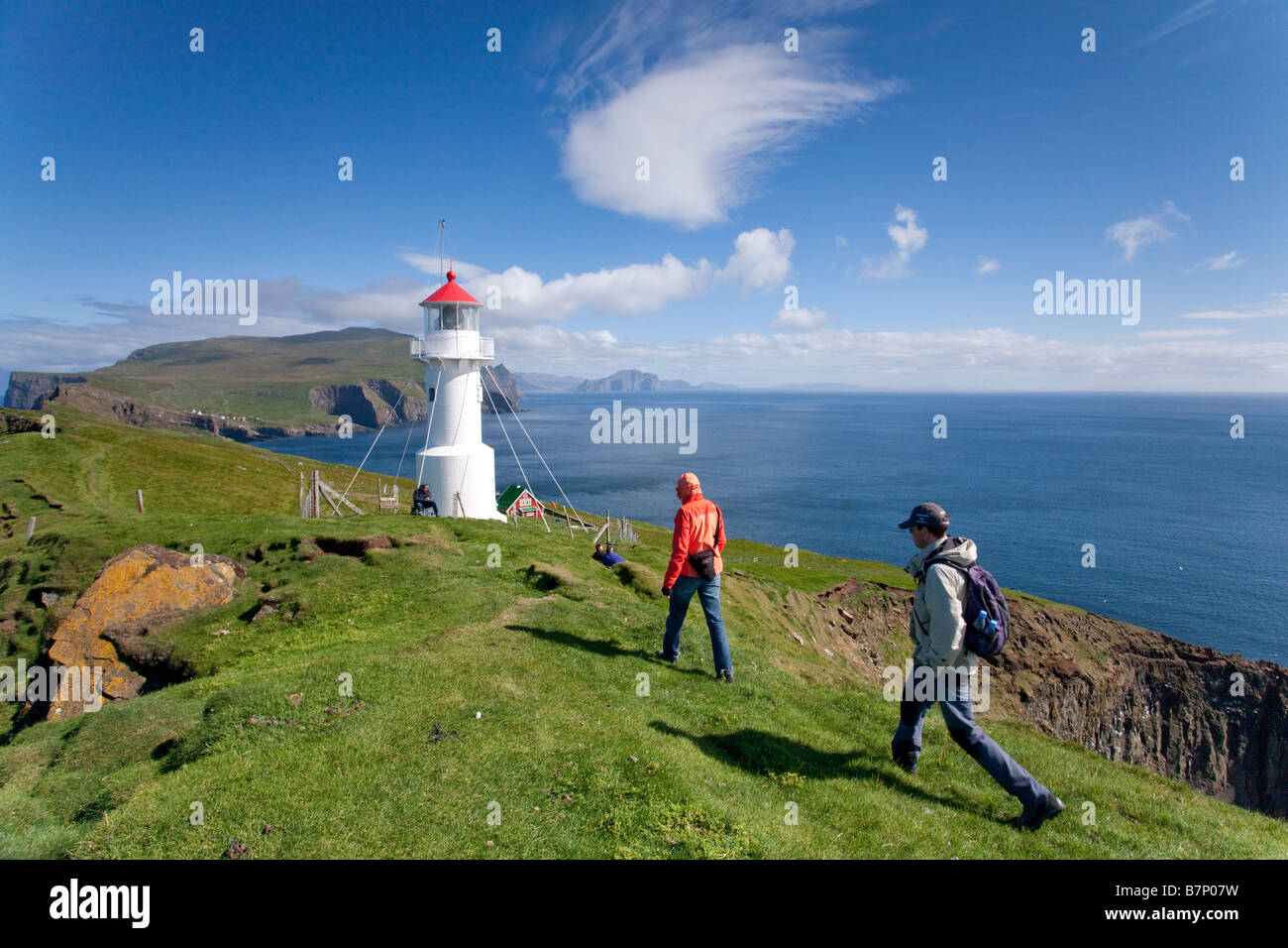 Persons walking in Mykines Island. Faroe Islands Stock Photo