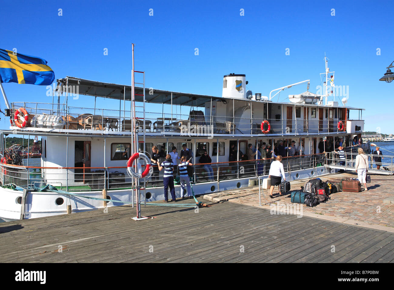 Sweden, Gothenburg, Boat Docking In Harbour Stock Photo