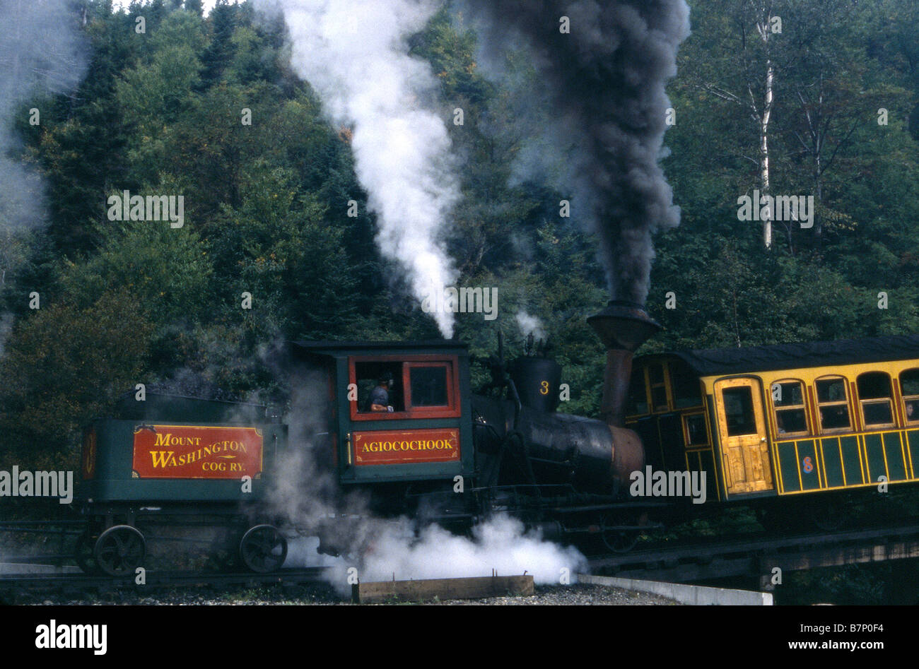 Steam Engine Smoking as it Chugs up Steep Grade Mount Washington Cog Railway New Hampshire USA Stock Photo