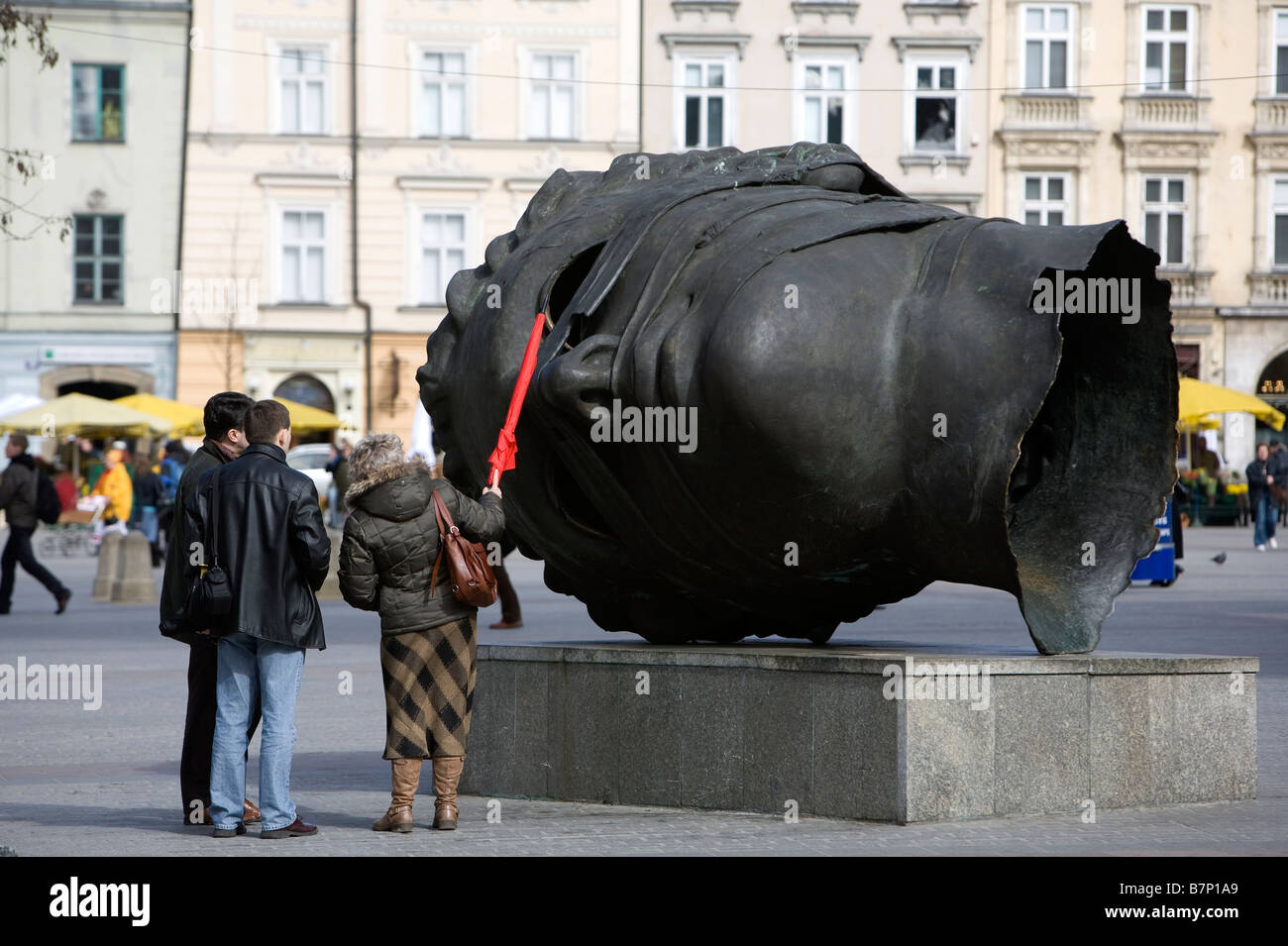 Sculpture of a head in The Main Market Square (Rynek Glowny), Krakow, Poland. Stock Photo