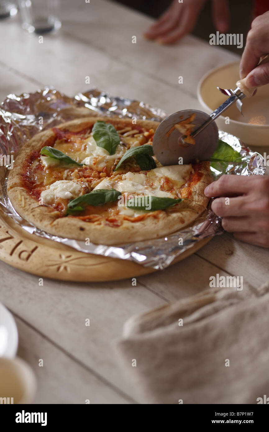Cutting pizza Stock Photo