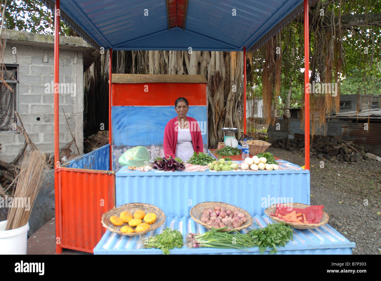 The owner of a grocers on the Isle of Mauritius Stock Photo