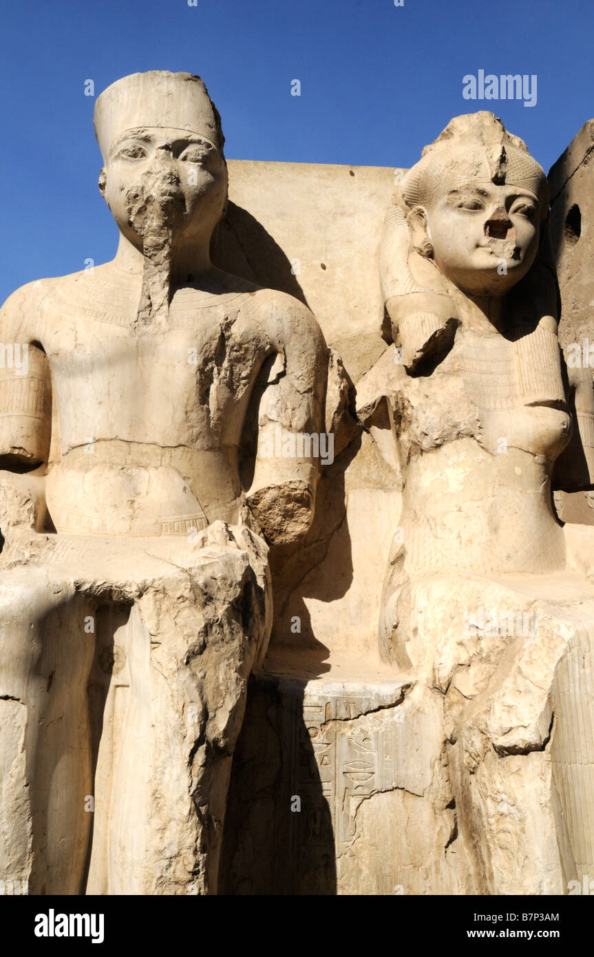 Statue of a Pharaoh and his Queen in theTemple Complex at Luxor in ...