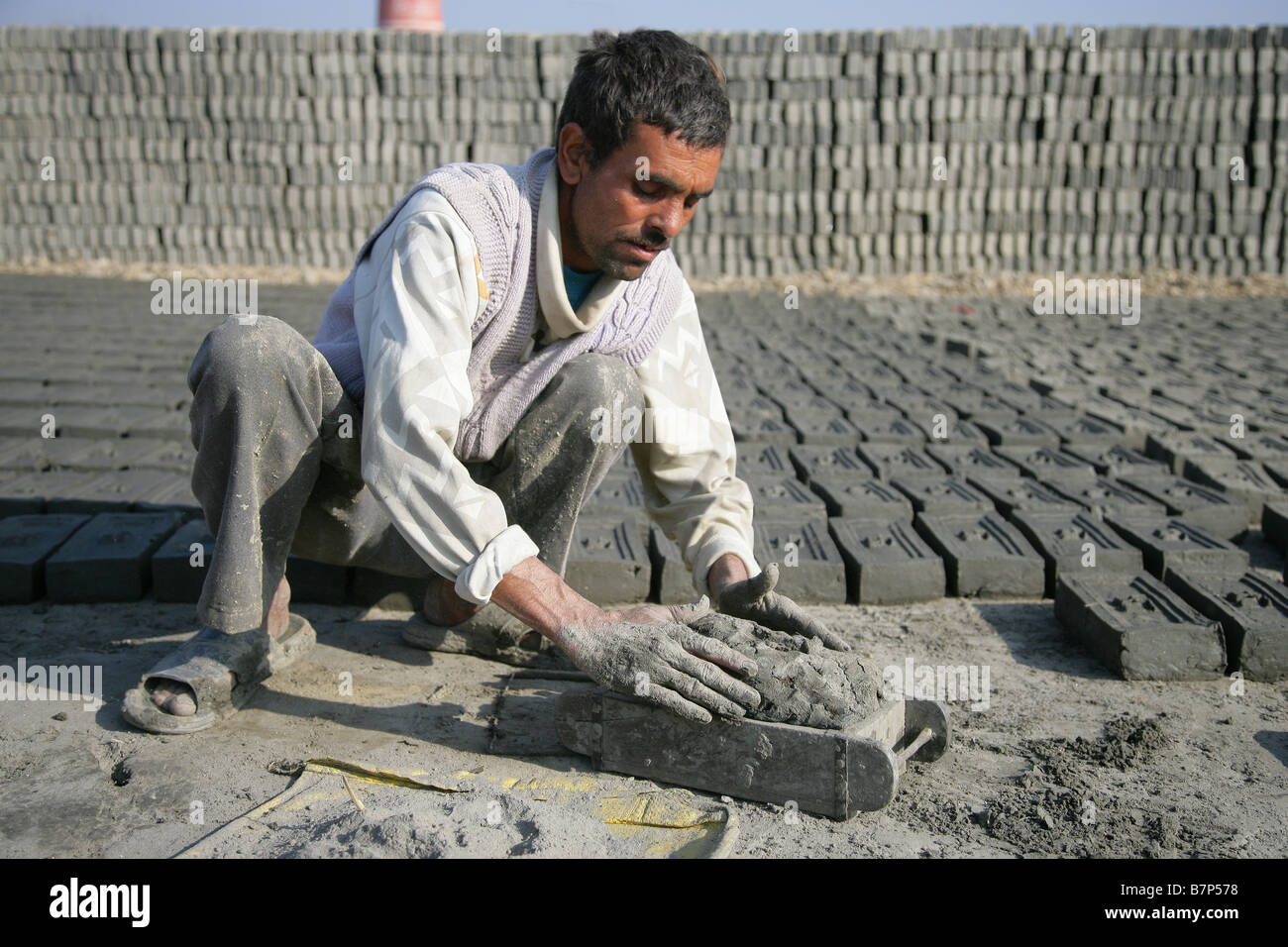 Mumurali Thapa producing hand made bricks Stock Photo