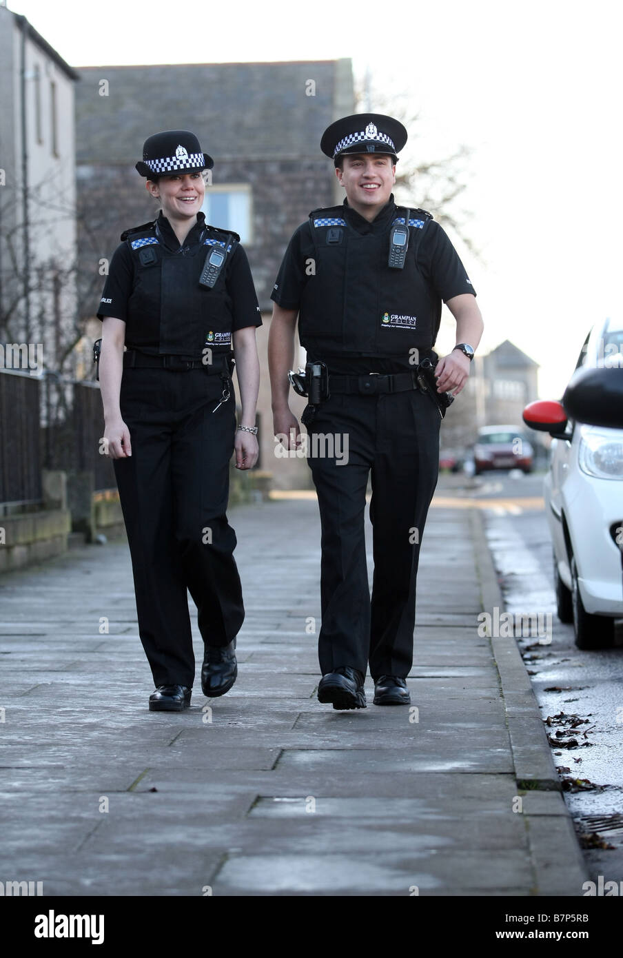 male and female Grampian Police officers from Aberdeen, Scotland, UK, on patrol in the city Stock Photo