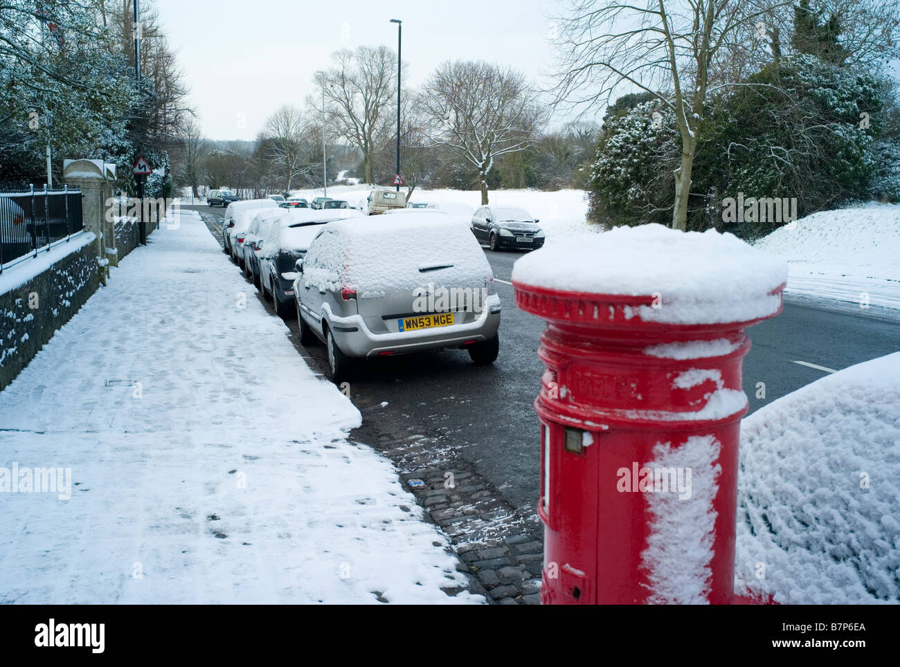Post box in the snow UK Stock Photo