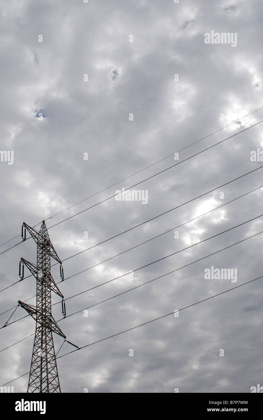 High voltage power line with dramatic sky background Stock Photo - Alamy
