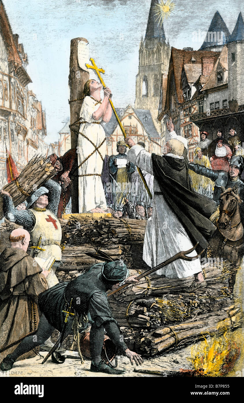 Joan of Arc burned at the stake for witchcraft and heresy in Rouen France 1431. Hand-colored woodcut Stock Photo