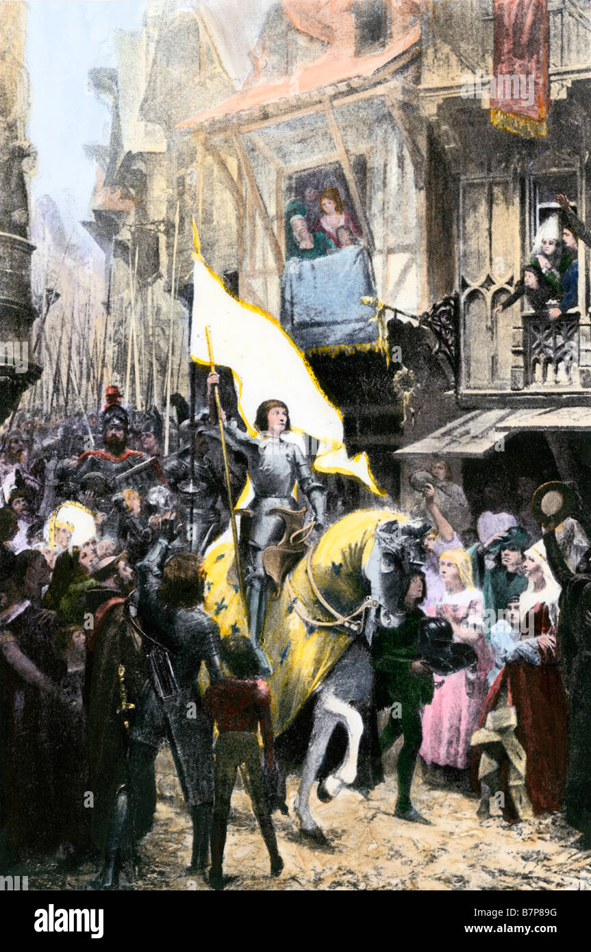 Joan of Arc carrying her sacred banner into Orleans after driving the English army from the city. Hand-colored halftone of an illustration Stock Photo