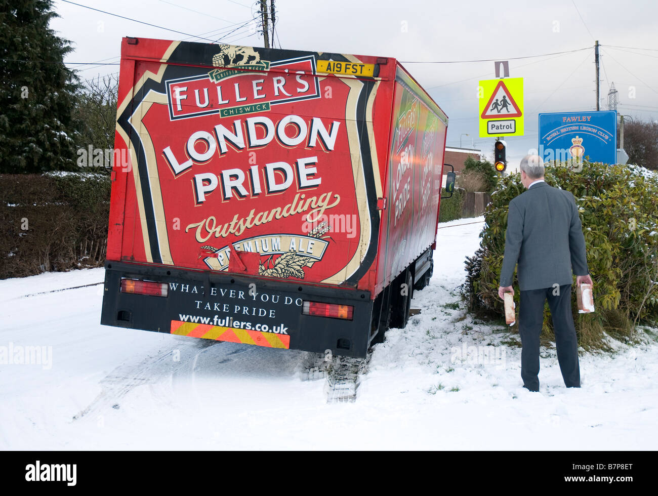 Mercedes Brewery lorry stuck in snowy ditch 2009 Stock Photo