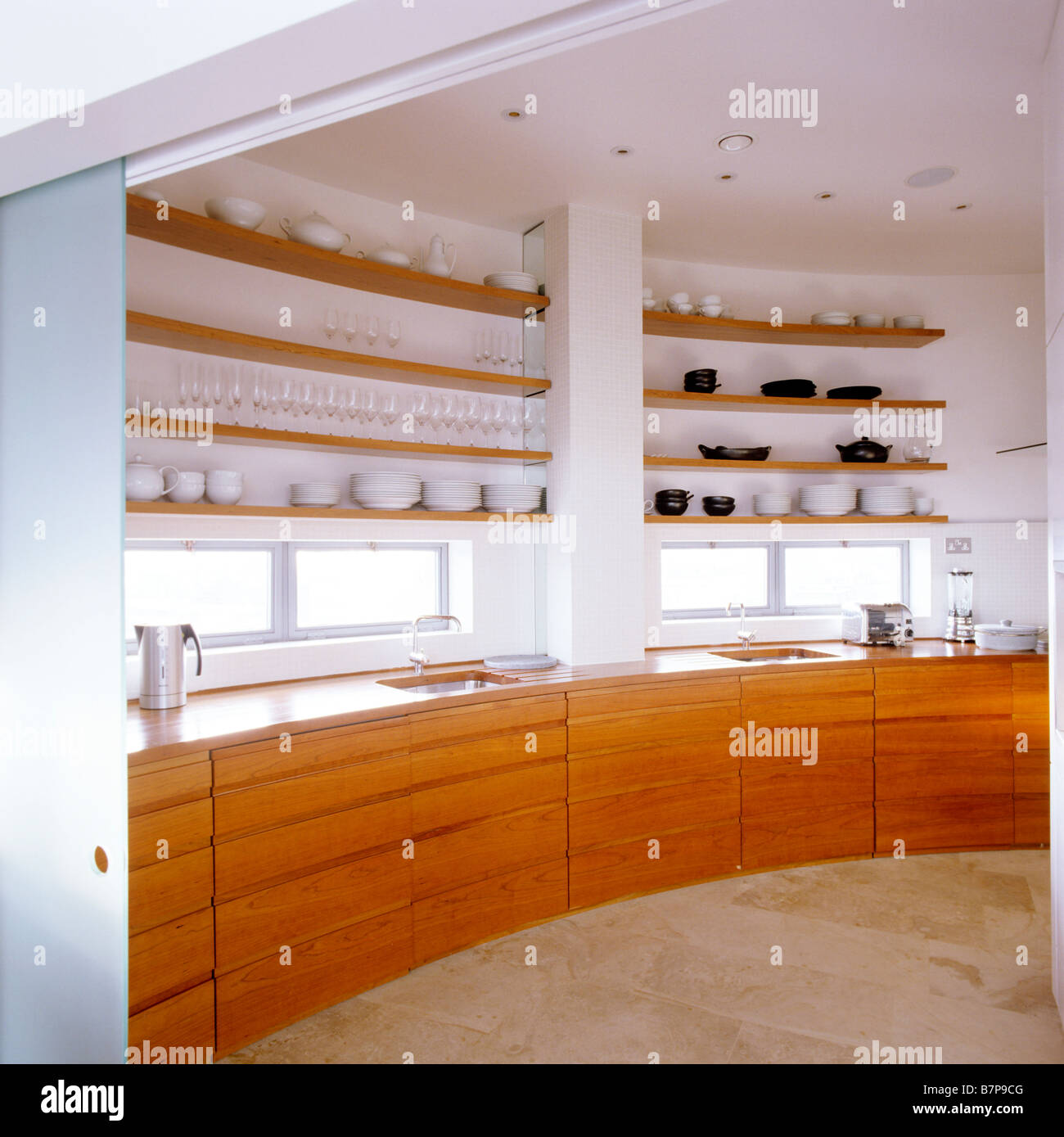 Image showcasing Modern kitchen with wood storage units and surfaces in London Penthouse ...