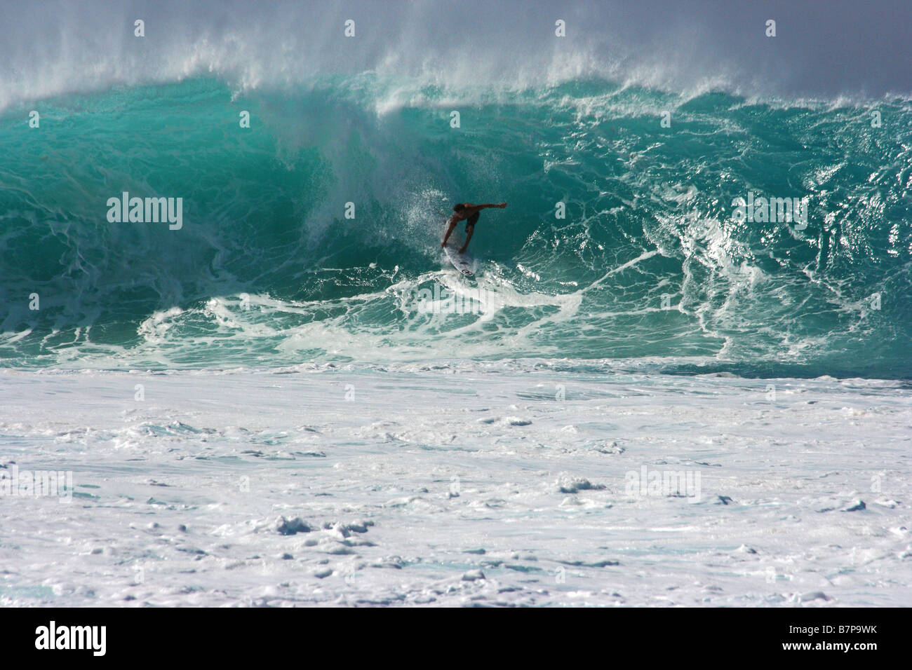 Surfer into barrel at Pipeline Banzai Beach, Oahu Hawaii Usa Stock Photo