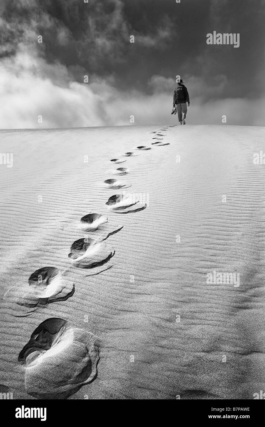 Lonely walker on the sand dunes of Oregon. Stock Photo
