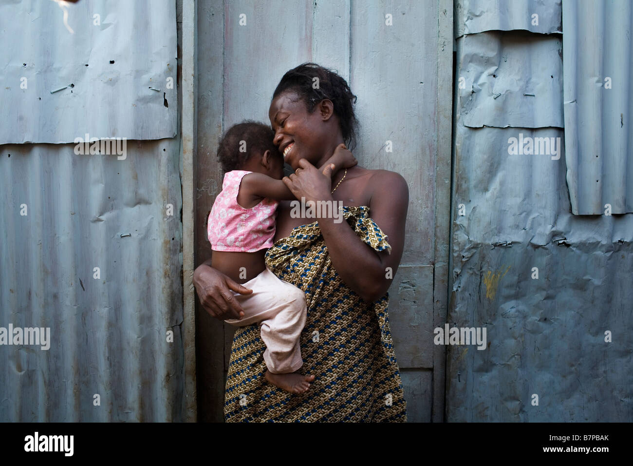 Nanday and her daughter outsides their home Kroo Bay  slum Freetown Sierra Leone Stock Photo