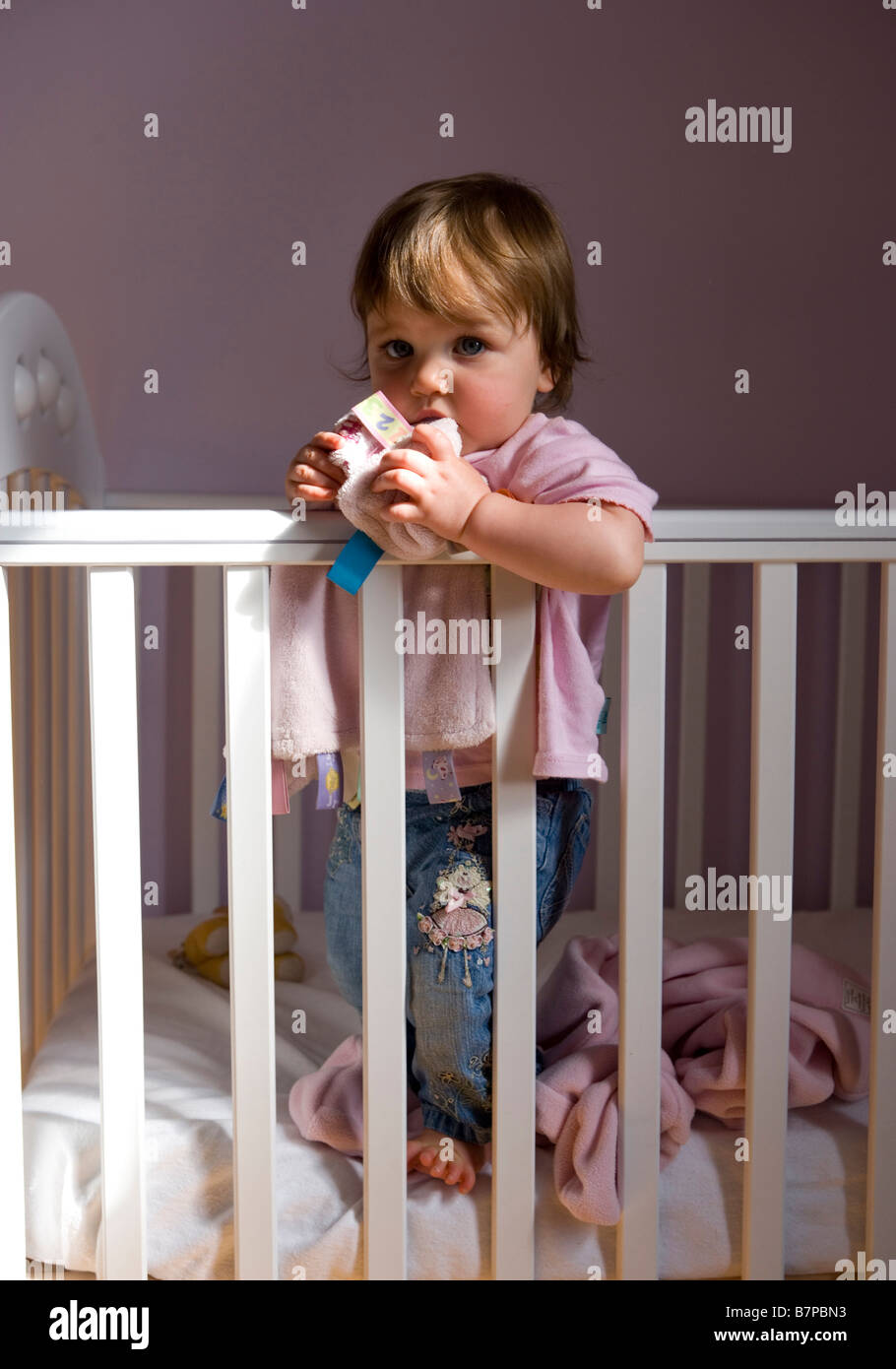 Toddler Standing In Cot High Resolution Stock Photography and Images
