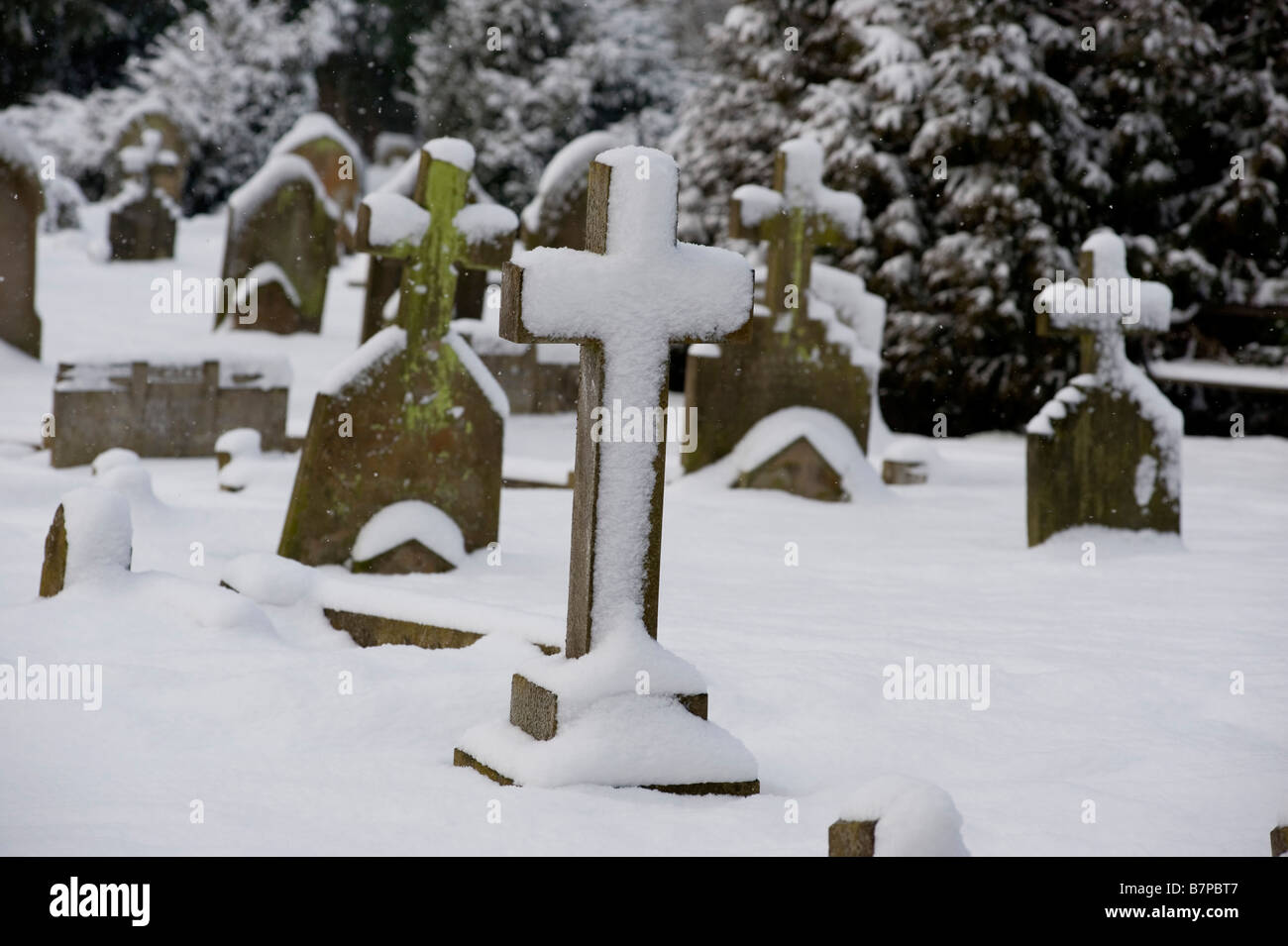 Cavendish Britain Snow Beautiful winter weather suffolk typical cemetery Stock Photo