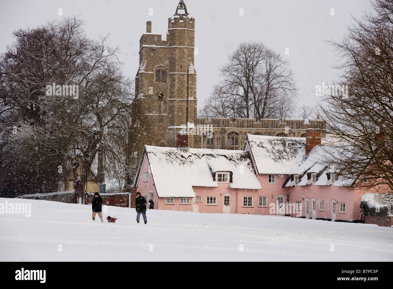 Heavy snow falling on the green and the Church of St Mary in the beautiful English village of Cavendish Suffolk Britain 3 febru Stock Photo