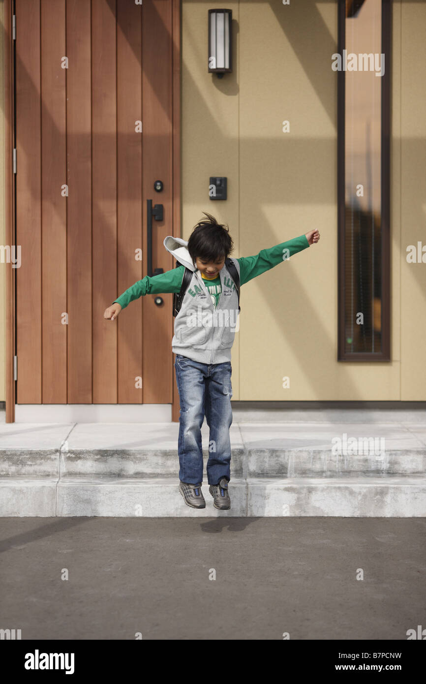 A boy going out of front door Stock Photo Alamy