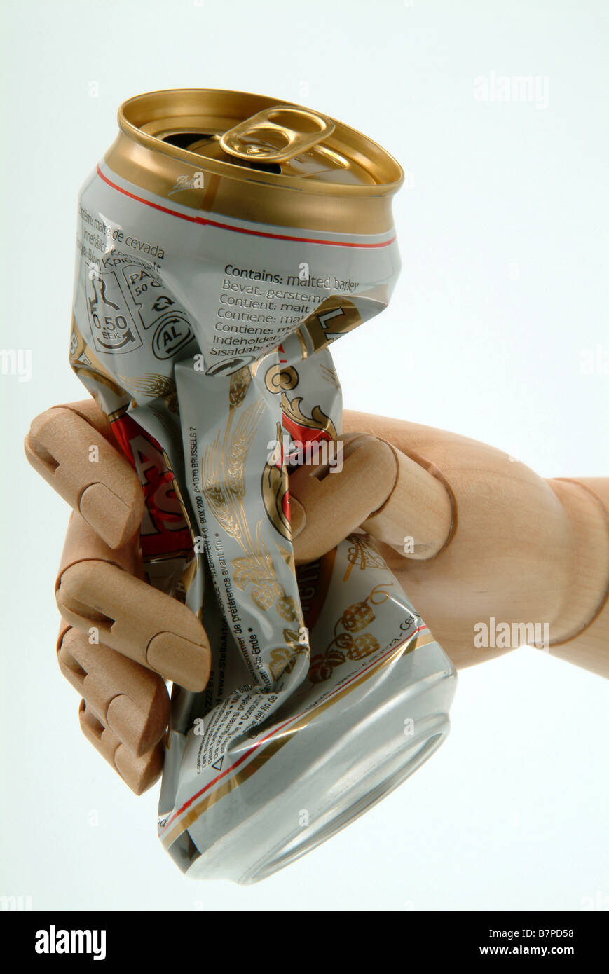 A wooden model hand crushing a drinks can Stock Photo Alamy