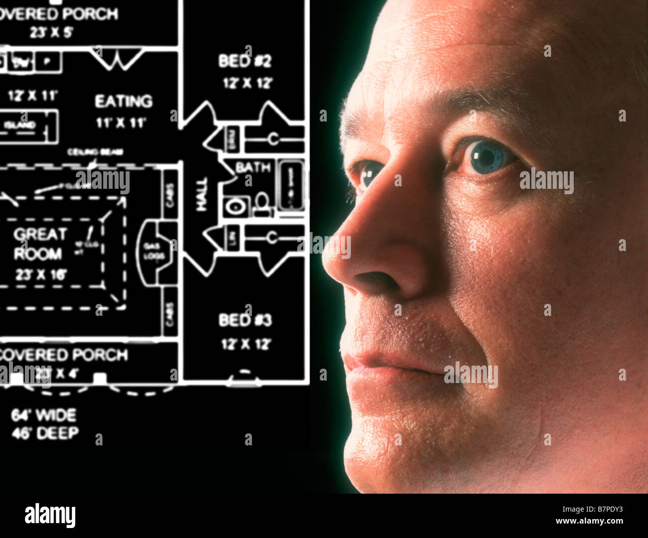 architect looking at projected house plans Stock Photo