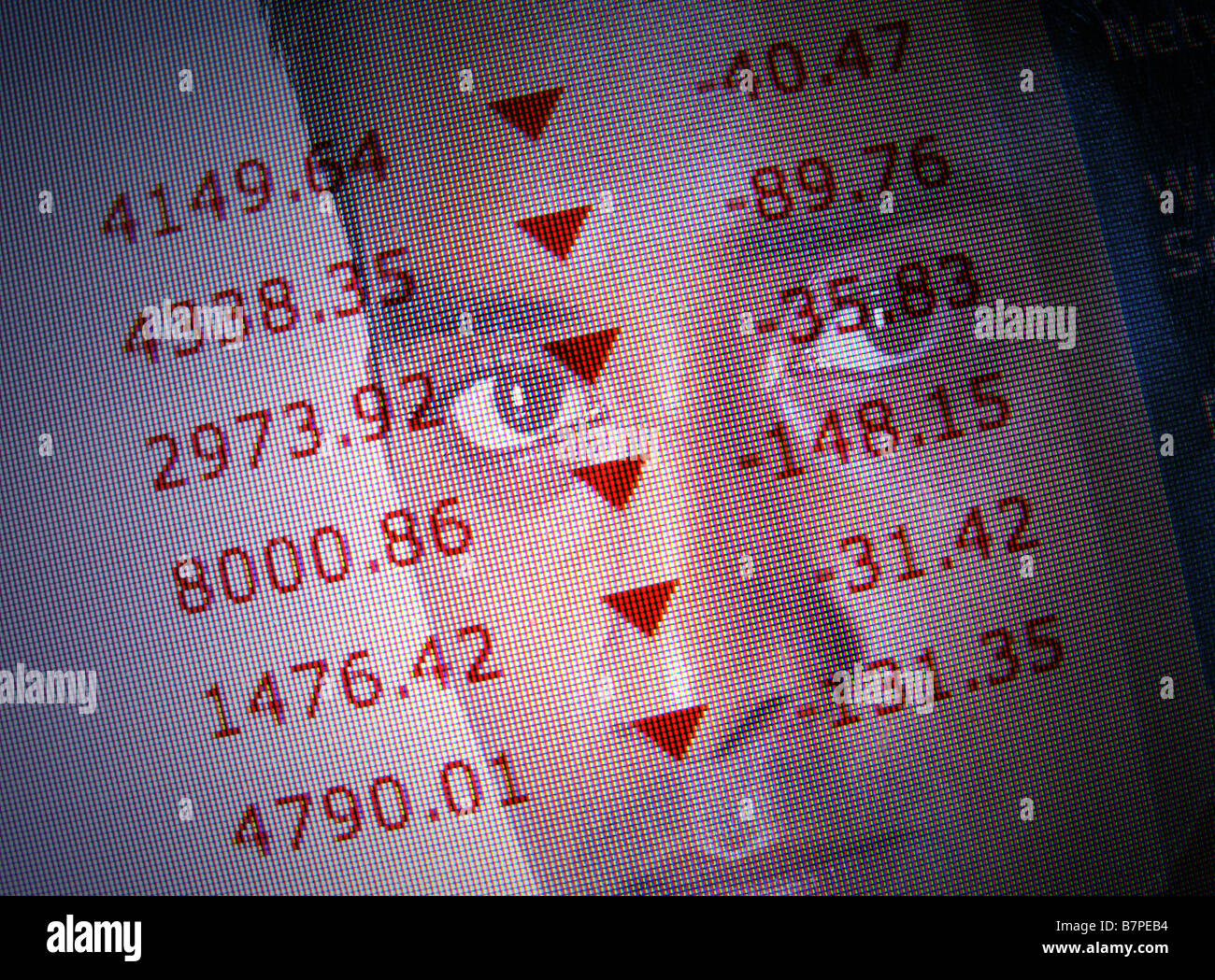 Businessman monitors falling stock markets Stock Photo