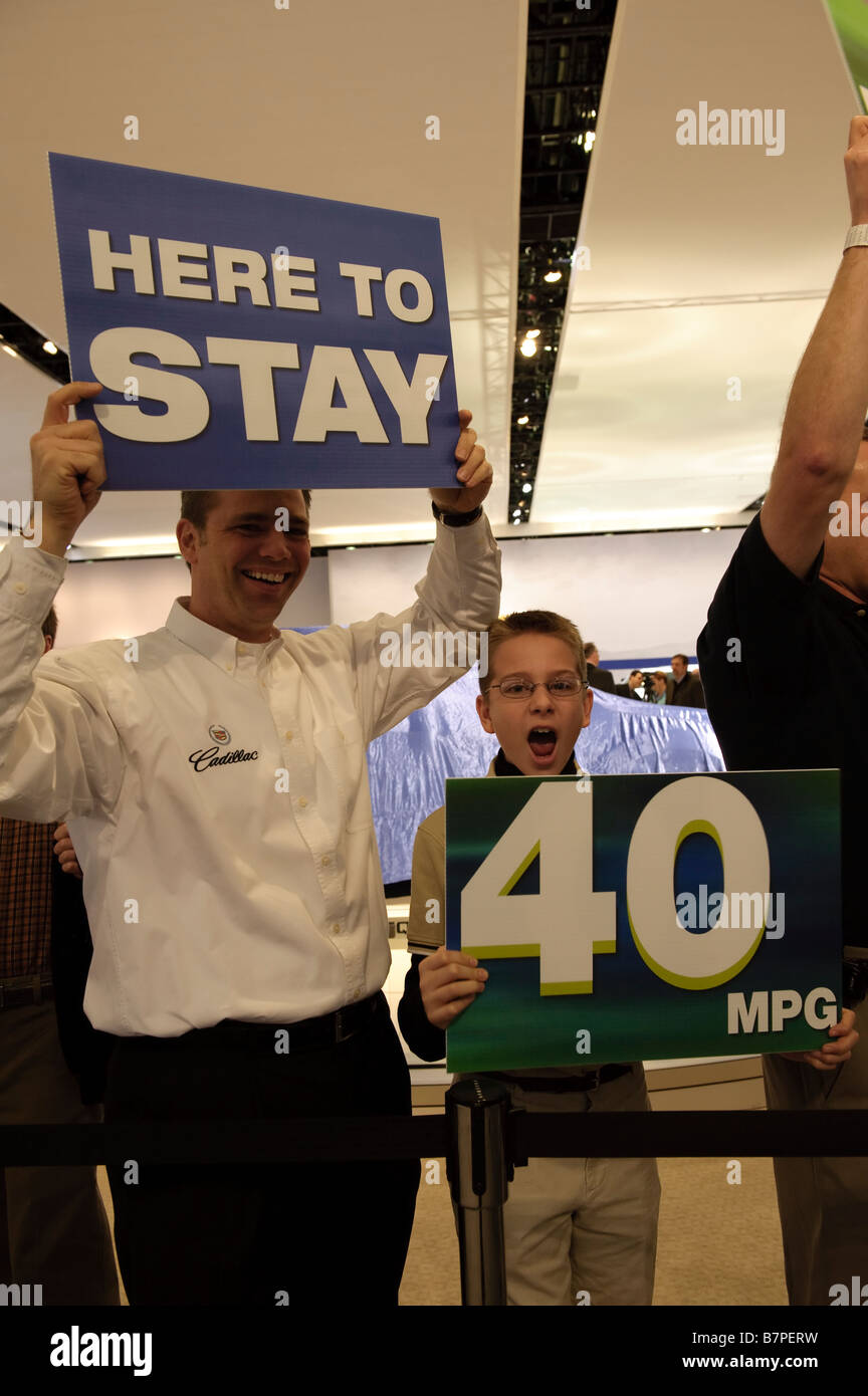 General Motors workers and families show support for their company before a press conference at the 2009 Detroit Auto Show Stock Photo