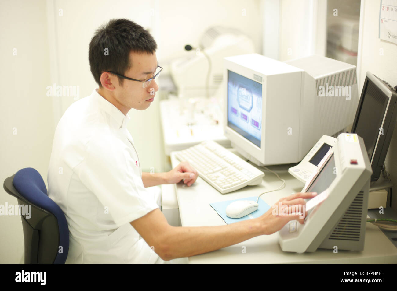Medical technologist performing CT scan Stock Photo Alamy