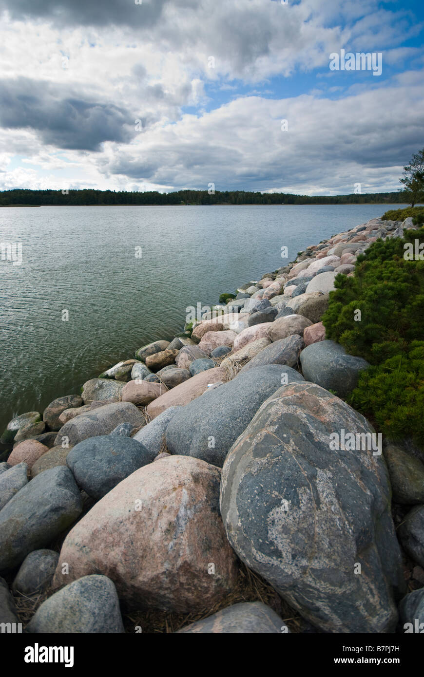 Boulders on the edge of the water Stock Photo