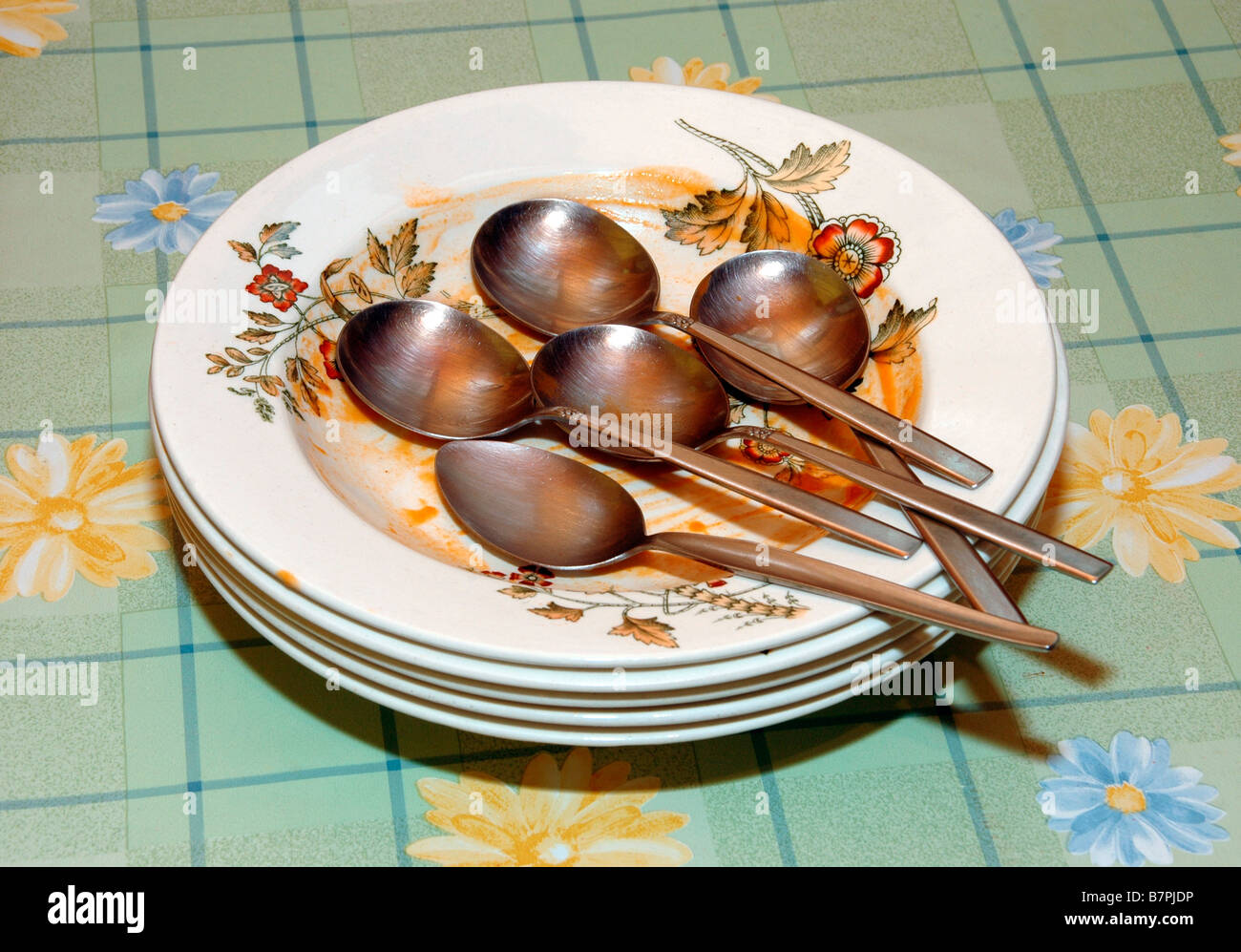 Dirty soup plates ready for washing. Stock Photo