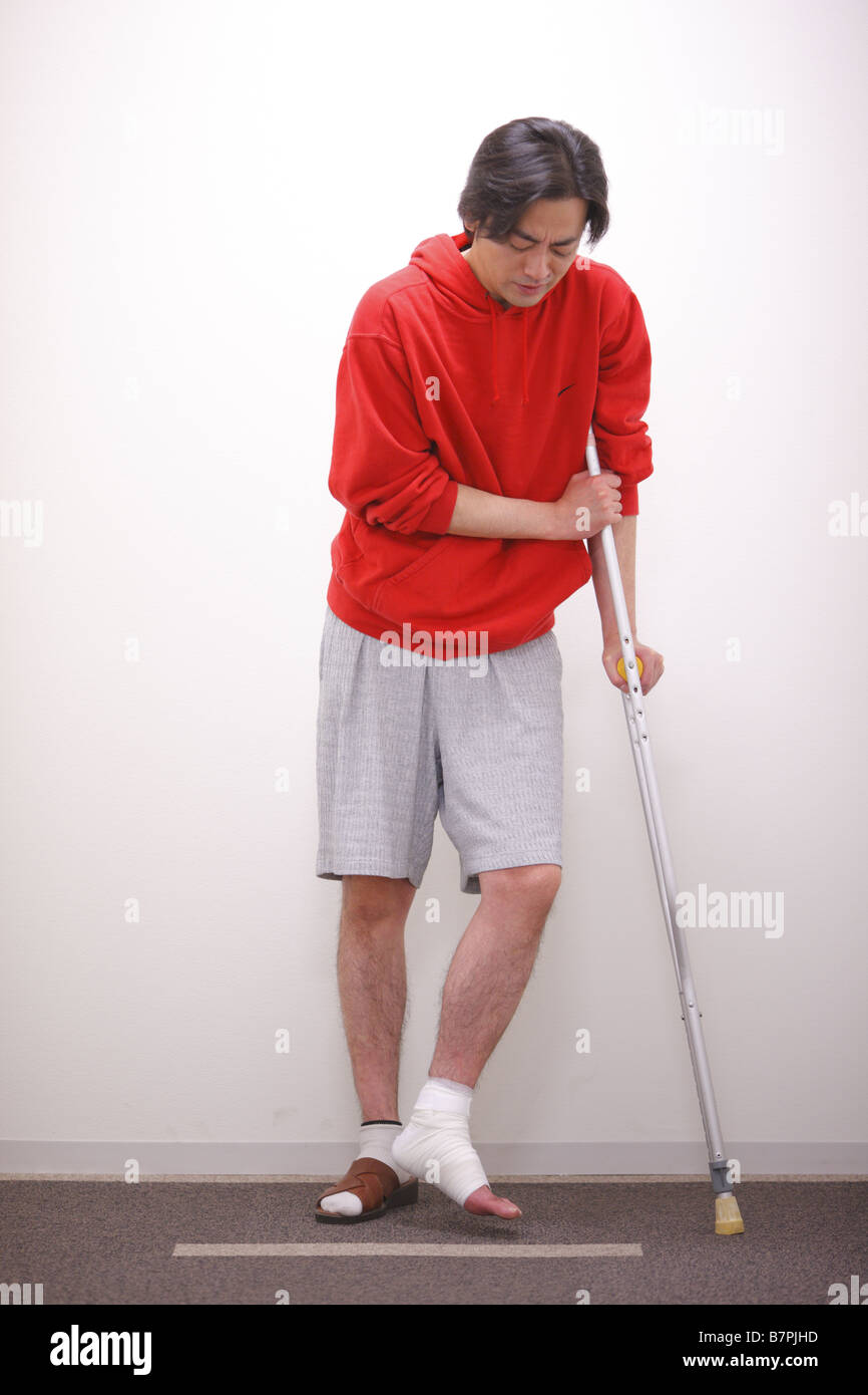 Male patient using axilla crutch Stock Photo