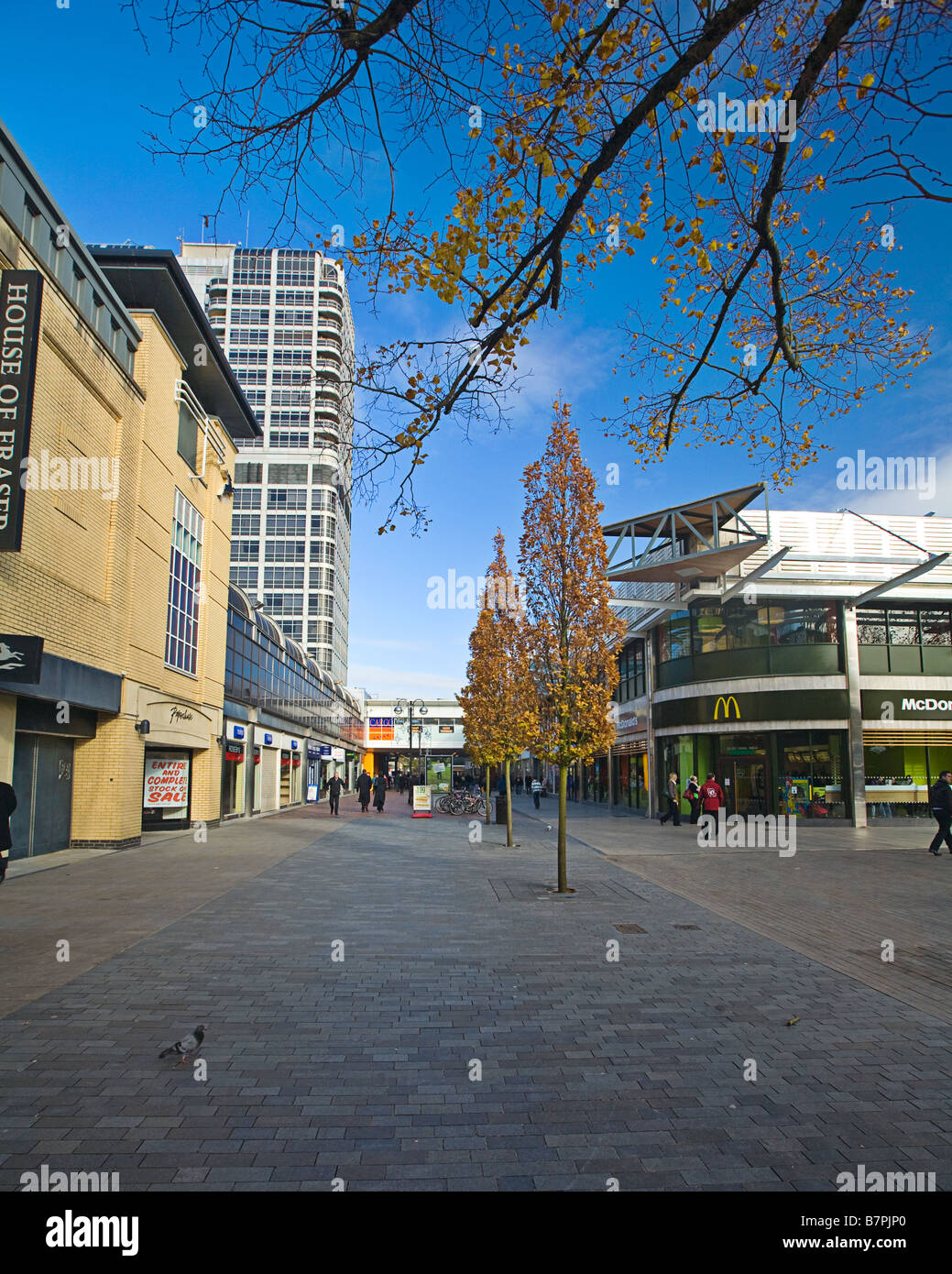 Swindon Hight Street looking by the Brunel centre. Blue sky overhead with autum colours on the trees. Stock Photo