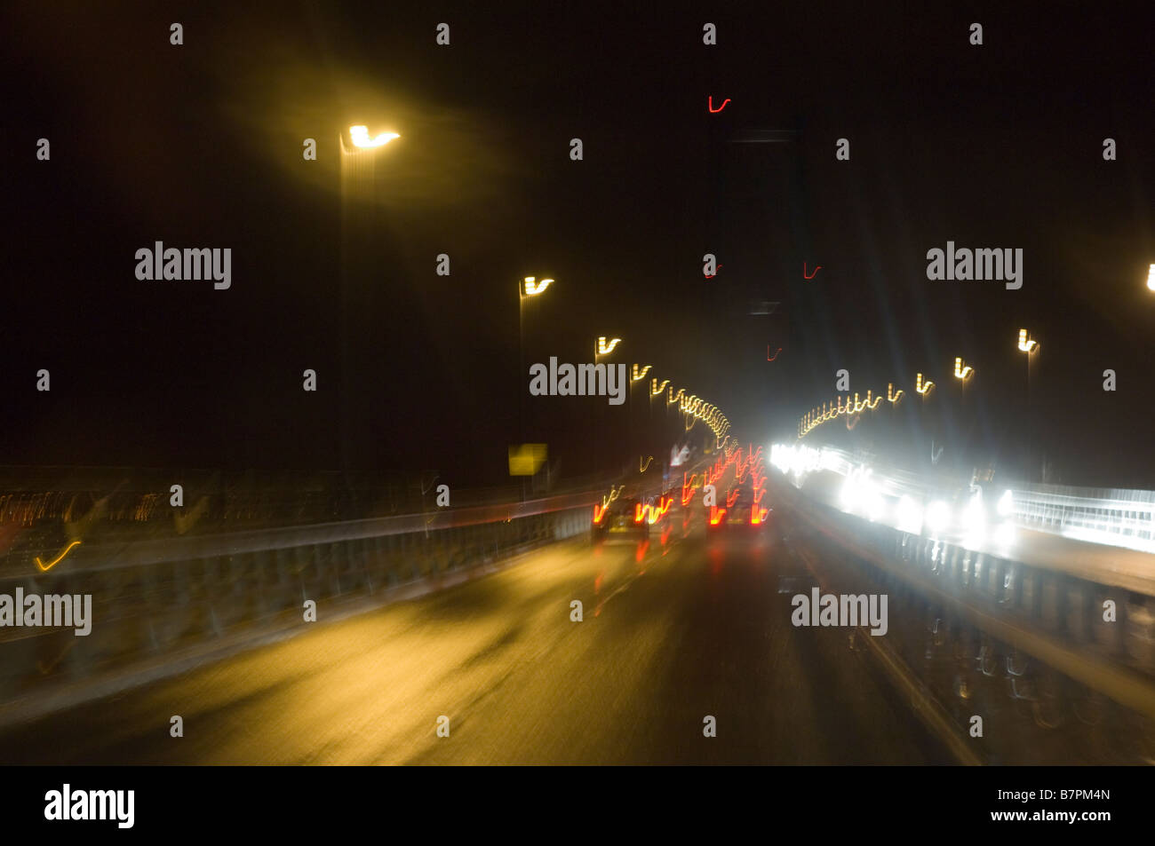 Traffic crossing the Forth Road Bridge, Edinburgh, at night Stock Photo