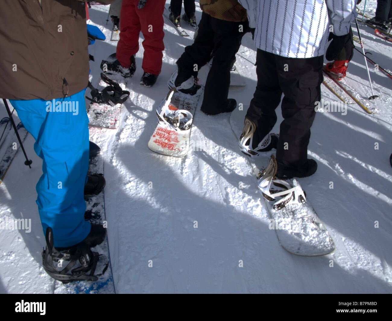 Snowboarders waiting in the chairlift line at Alpine Meadows Ski Area ...
