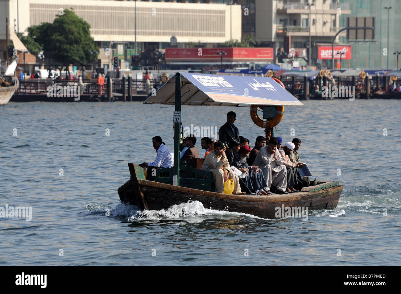 Abra ferrying passengers across the Dubai creek Stock Photo